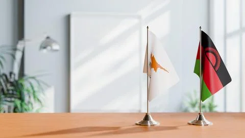 FLAGS OF CYPRUS AND MALAWI ON TABLE Stock Photos