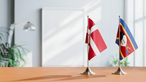 FLAGS OF DENMARK AND ESWATINI ON TABLE Stock Photos