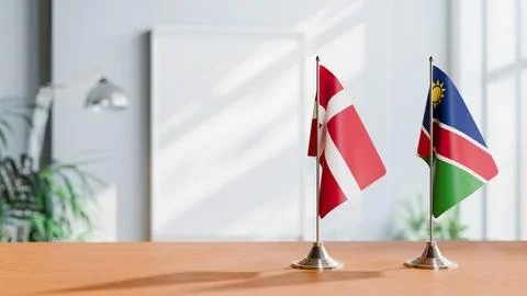 FLAGS OF DENMARK AND NAMIBIA ON TABLE Stock Photos