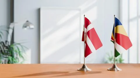 FLAGS OF DENMARK AND SEYCHELLES ON TABLE Stock Photos