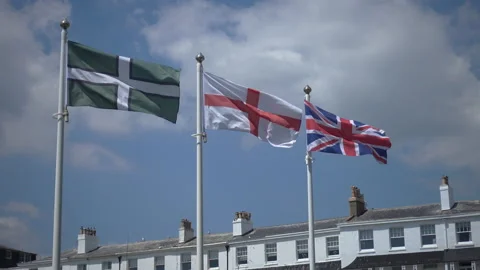 The flags of Devon, England and the UK flying together. Stock Footage 156190545