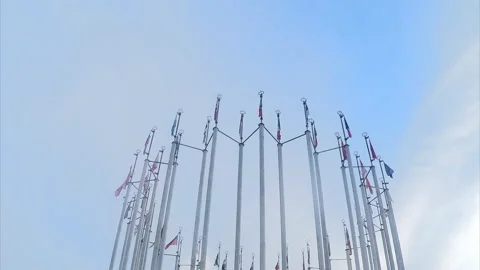 Flags of different countries against the blue sky timelapse 스톡 동영상 87219444