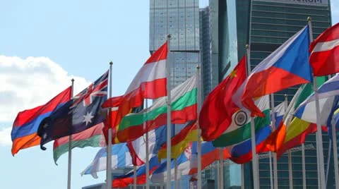 Flags of the different countries against the business center Stock Footage