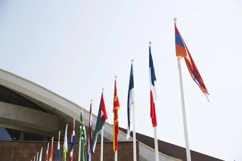 Flags of different countries against the sky Foto stock