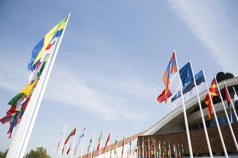 Flags of different countries against the sky Foto stock