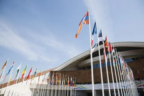 Flags of different countries against the sky Stock-Fotos