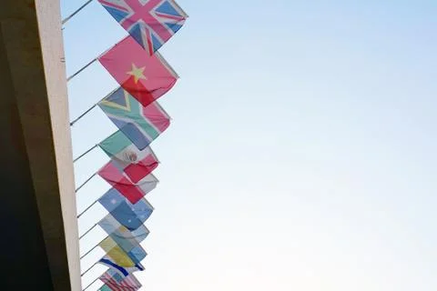 Flags of different countries on the background of the blue sky Stock Photos