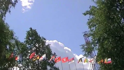 Flags of different countries on the background the sky Stock Footage 93597609