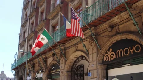 Flags of different countries waving on the facade of a hotel. Stock Footage 155594307