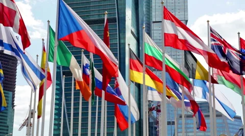 Flags of the different countries of the world against the business center Stock Footage 50990604