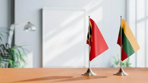FLAGS OF EAST TIMOR AND LITHUANIA ON TABLE Stock Photos