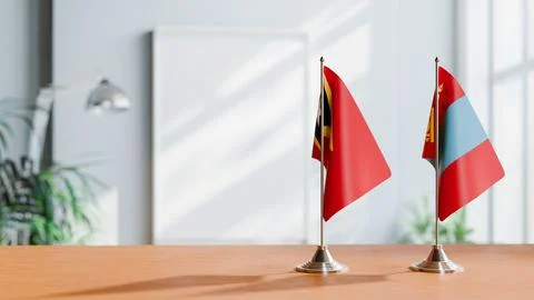 FLAGS OF EAST TIMOR AND MONGOLIA ON TABLE Stock Photos