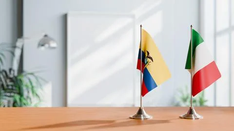 FLAGS OF ECUADOR AND ITALY ON TABLE Stock Photos