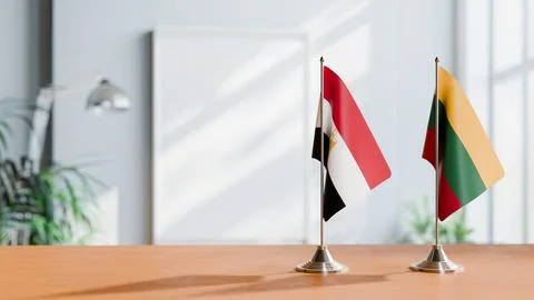 FLAGS OF EGYPT AND LITHUANIA ON TABLE Stock Photos