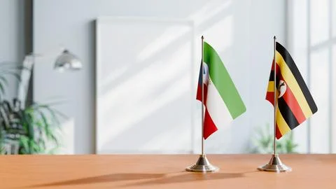 FLAGS OF EQUATORIAL GUINEA AND UGANDA ON TABLE Stock Photos