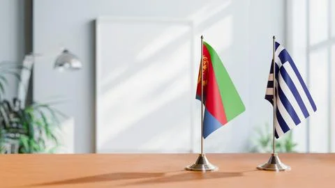 FLAGS OF ERITREA AND GREECE ON TABLE Stock Photos