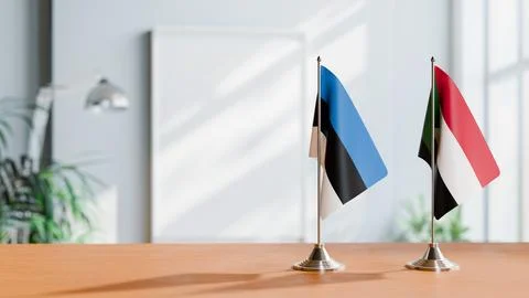 FLAGS OF ESTONIA AND SUDAN ON TABLE Stock Photos