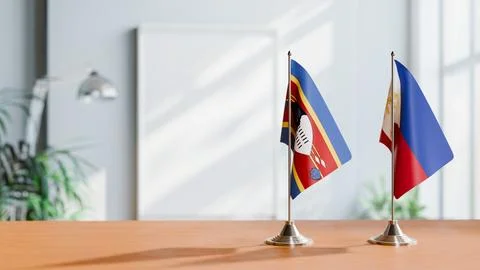 FLAGS OF ESWATINI AND PHILIPPINES ON TABLE Stock Photos