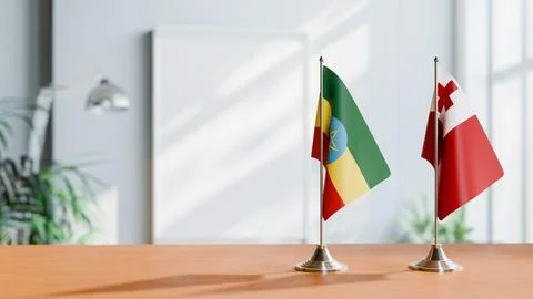 FLAGS OF ETHIOPIA AND TONGA ON TABLE Stock Photos