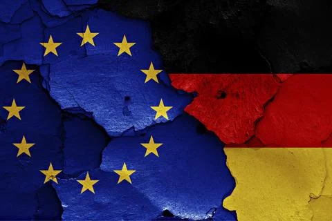 Flags of EU and Germany painted on cracked wall Ilustración de archivo