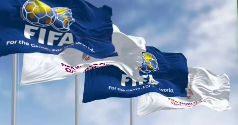 Flags with FIFA and Qatar 2022 World Cup logo waving in the wind Stock Footage 202188917