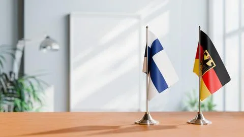 FLAGS OF FINLAND AND GERMANY ON TABLE Stock Photos