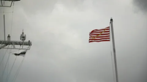 Flags on flagpoles fluttering in the wind Stock Footage 117731683