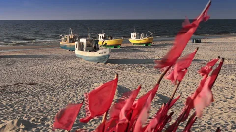 Flags flapping in the wind, Baltic Sea beach Stock Footage 32594468