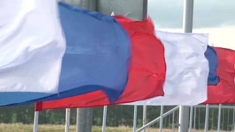 Flags flutter in the wind white, blue, red Stock Footage 276965461