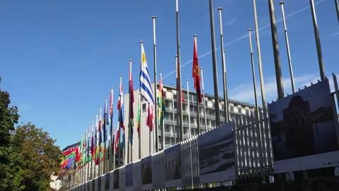 Flags fluttering in the wind in front of the UNESCO in Paris, France Stock Footage 218202144