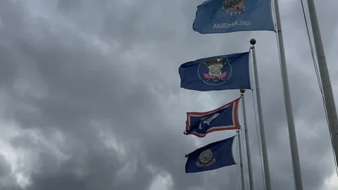 Flags fly in strong winds outside of Union Station DC Stock Footage 141834063