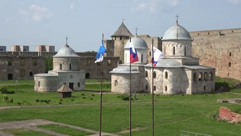 Flags flying against the background of the Ivangorod fortress. Russia Video stock 285850286