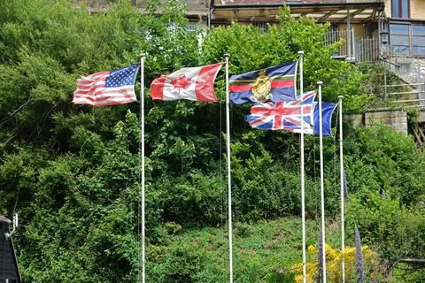 Flags flying at The Commando Memorial at Shanklin Chine, Isle of Wight. Stock Photos