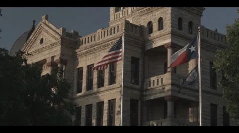 Flags in front of courthouse Stock Footage 32519093