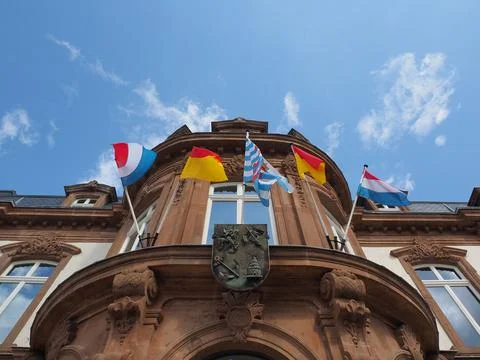 Flags on the front facade of the city hall in Wiltz Stock Photos