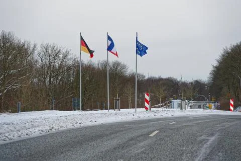 Flags at German Danish border during winter storm Elli Goretti January 2026 Stock Photos