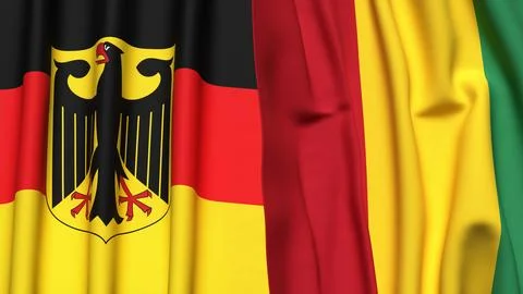Flags of GERMANY and GUINEA with realistic cloth texture Stock Photos