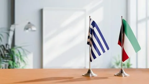FLAGS OF GREECE AND KUWAIT ON TABLE Stock Photos
