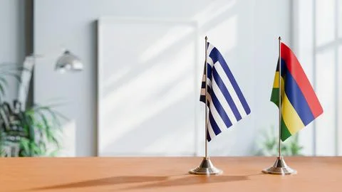 FLAGS OF GREECE AND MAURITIUS ON TABLE Stock Photos