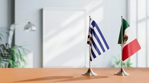 FLAGS OF GREECE AND MEXICO ON TABLE Stock Photos