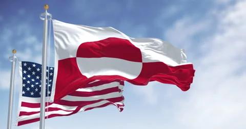 Flags of Greenland and the US waving in the wind on a clear day 스톡 동영상 340883318