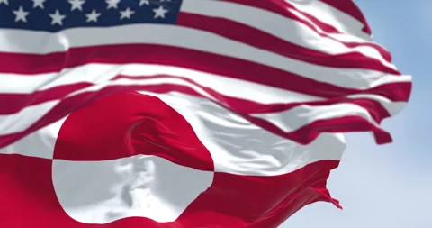 Flags of Greenland and the US waving in the wind on a clear day Stock Footage 341681014