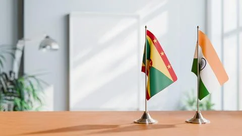 FLAGS OF GRENADA AND INDIA ON TABLE Stock Photos