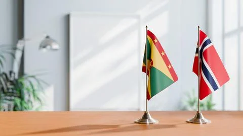 FLAGS OF GRENADA AND NORWAY ON TABLE Stock Photos