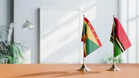 FLAGS OF GRENADA AND VANUATU ON TABLE Stock Photos