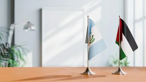 FLAGS OF GUATEMALA AND JORDAN ON TABLE Stock Photos