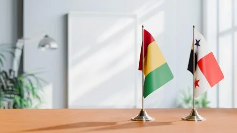 FLAGS OF GUINEA And PANAMA ON TABLE Stock Photos