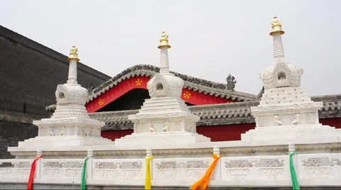 Flags hang from the eaves of a Chinese temple. Stock Footage 908658