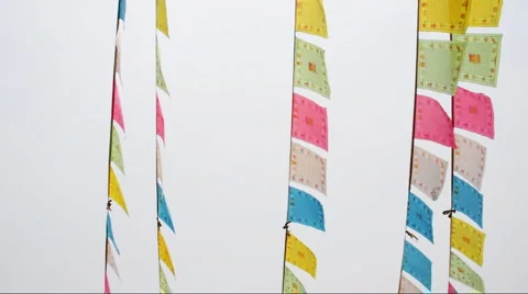 Flags hang from the eaves of a Chinese temple. Stock Footage 908660