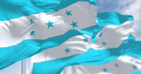 Flags of Honduras waving against a clear sky Stock Footage 289632800